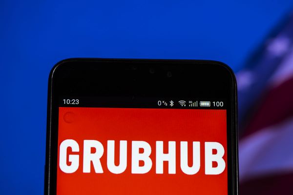 App Grubhub su smartphone. Uber Eats e acquisizioni nel food delivery.