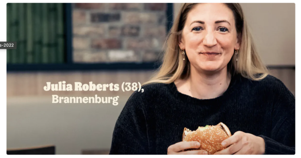 Campagna Burger King: donna sorridente mangia hamburger. Julia Roberts (38) a Brannenburg.